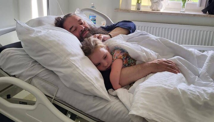 One of his adopted daughters came to see Met. Longin in the hospital. Photo:
